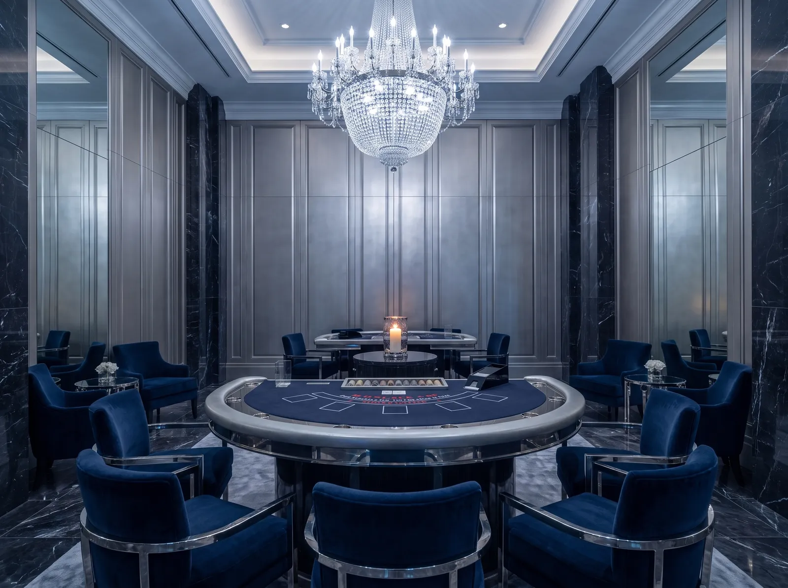 A single card table under one chandelier in Salon Argent